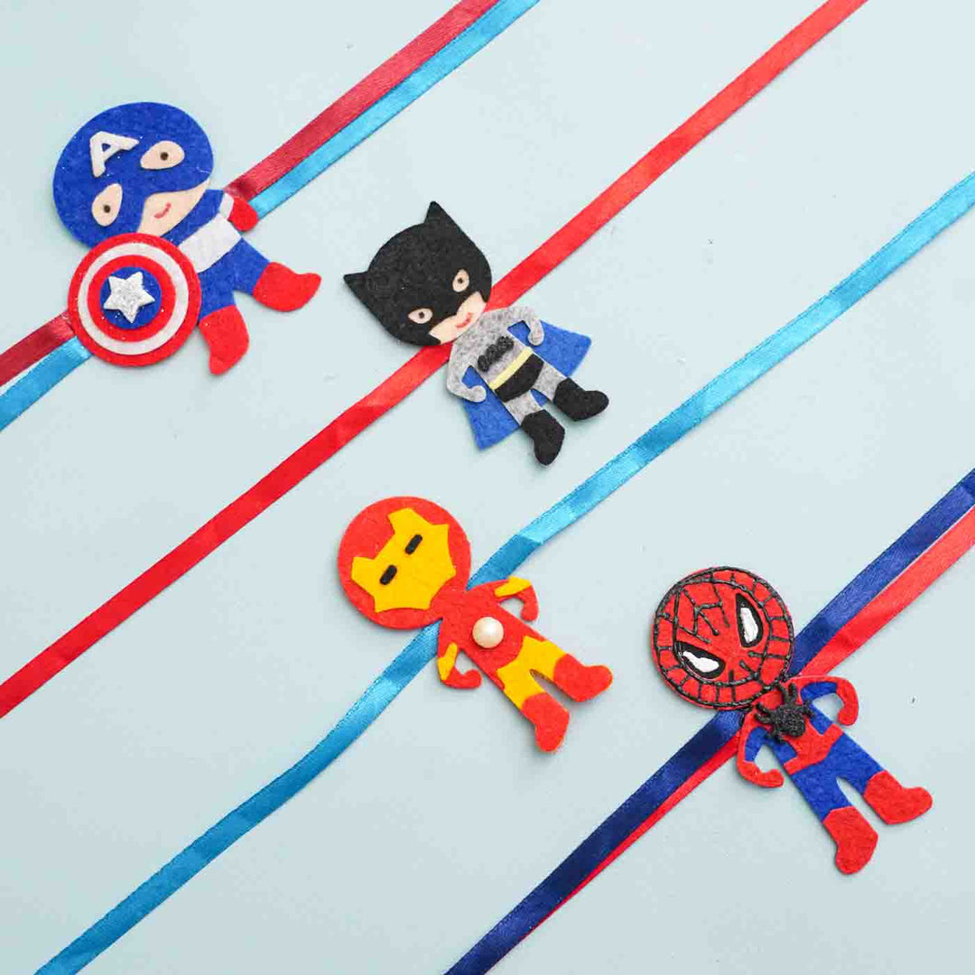Handmade Captain America Theme Felt Kids Rakhi With Roli Chawal - Multiple superhero rakhis displayed