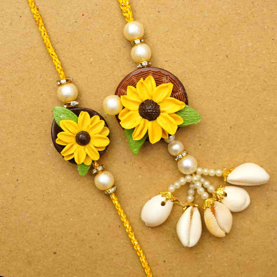 Handmade Sunflower Clay Bhaiya Bhabhi Rakhi With Chocolates And Roli Chawal Set Of 2 - Close-up of Two Rakhis
