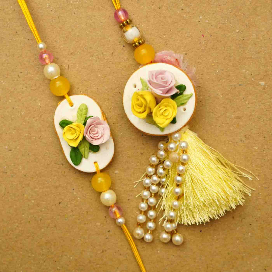 Handmade Rose Clay Bhaiya Bhabhi Rakhi With Chocolates And Roli Chawal Set Of 2 - Close-up Front View