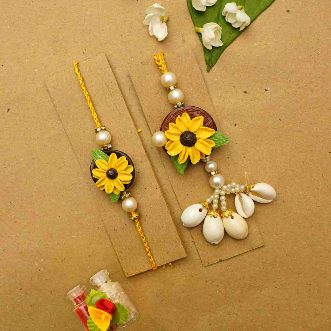 Handmade Sunflower Clay Bhaiya Bhabhi Rakhi With Chocolates And Roli Chawal Set Of 2 - Rakhis on Display Cards