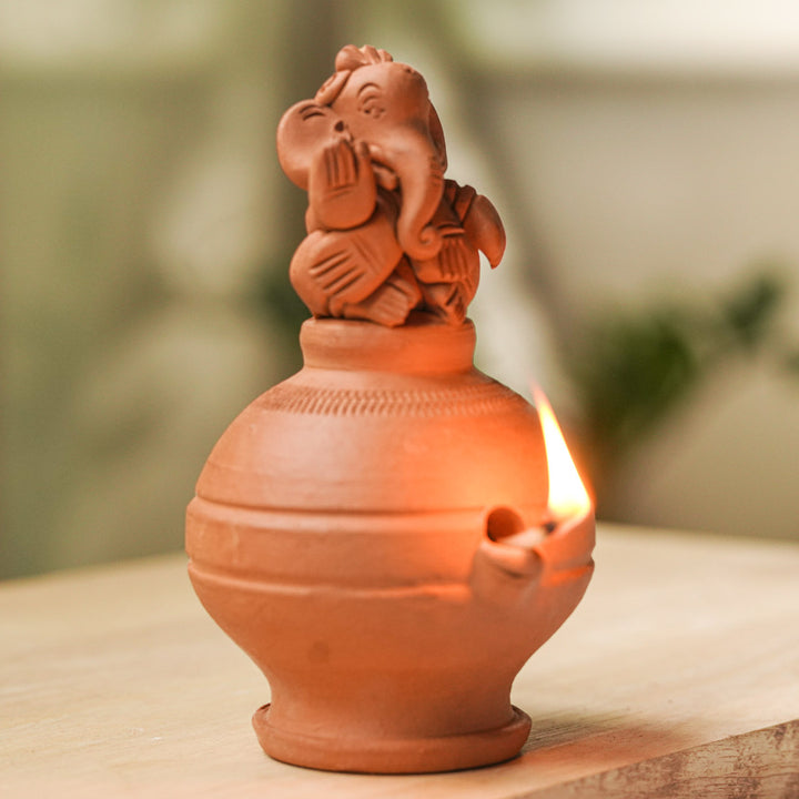 Handmade Ganesh Design Terracotta Oil Lamp / Diya | Includes 1 Magic Diya And 2 Diyas