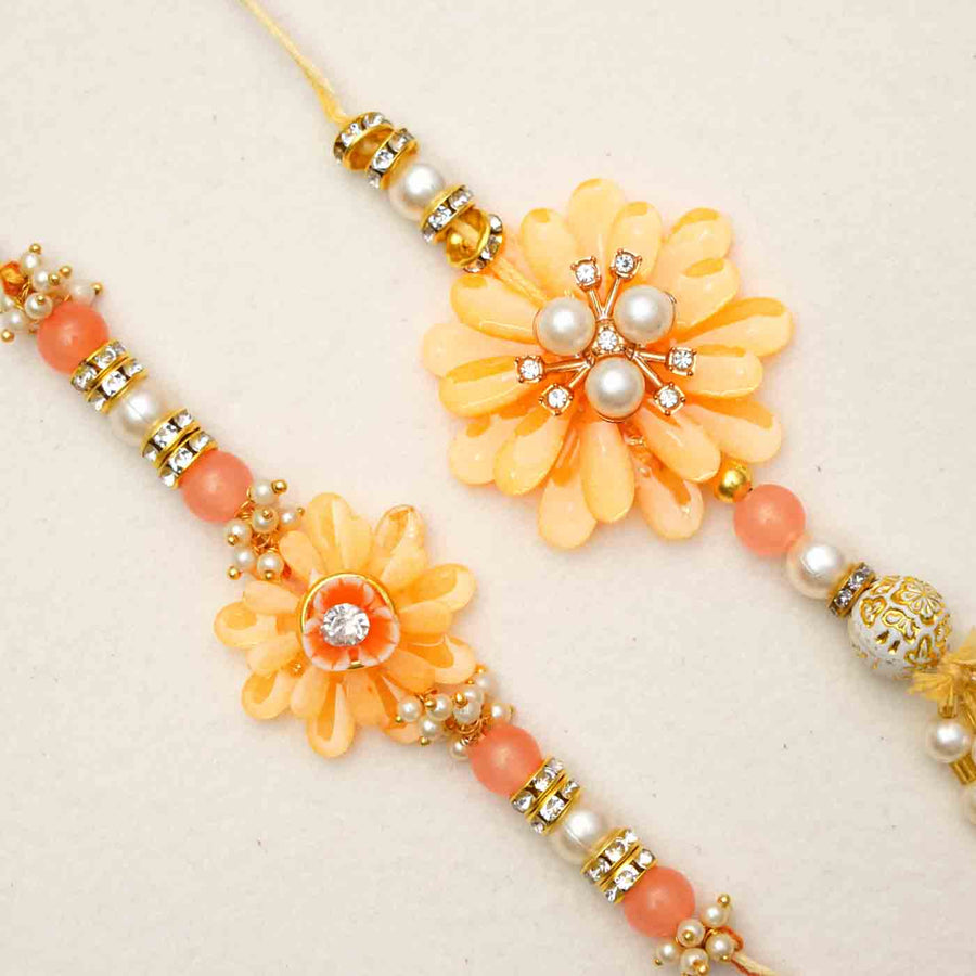 Handmade Resin Peach Flower With Pearls Bhaiya Bhabhi Rakhi With Chocolates And Roli Chawal Set Of 2 - Close-up of Rakhi Details