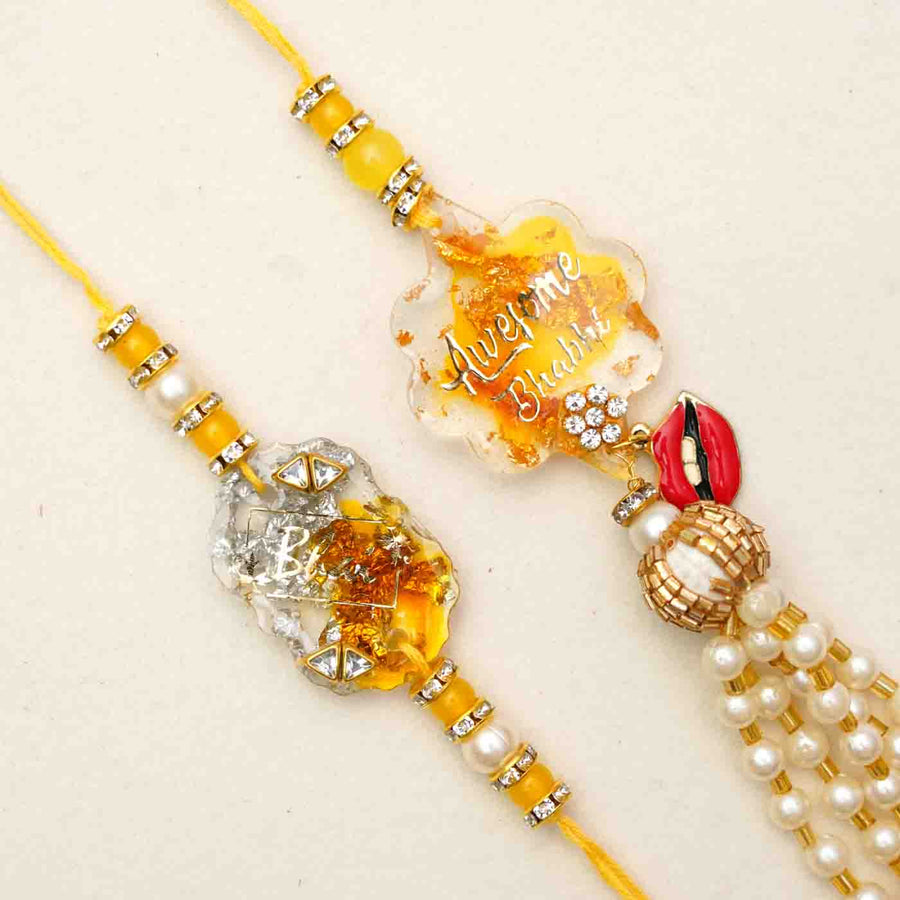 Handmade Resin Bhai And Awesome Bhabhi Rakhi With Chocolates And Roli Chawal Set Of 2 - Close-up of two rakhis