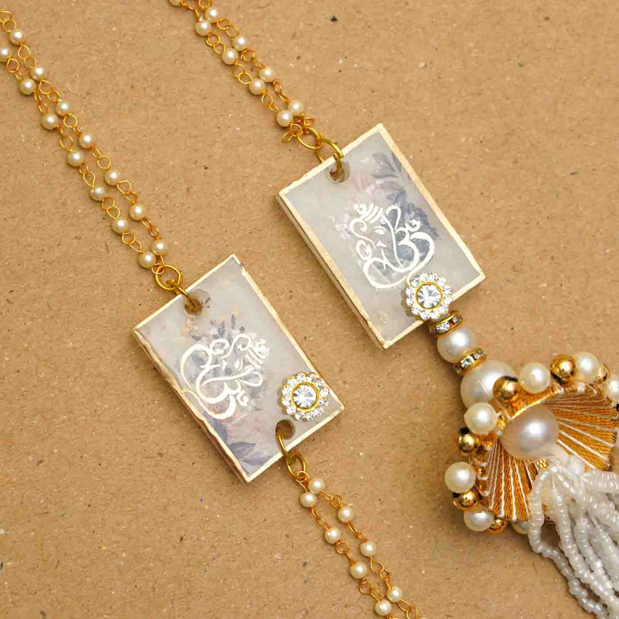 Handmade Resin Ganesha Bhaiya Bhabhi Rakhi With Chocolates And Roli Chawal Set Of 2 - Close-up of Pair of Bracelets