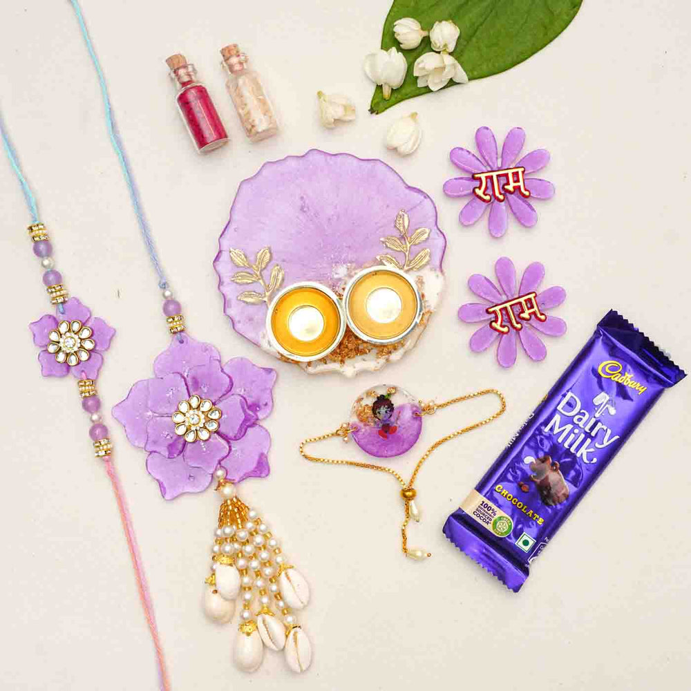 Handmade Purple Floral Theme Resin Rakhi Hamper With Chocolates And Roli Chawal For Bhaiya Bhabhi And Kids Set Of 6 - Flat Lay with Additional Items