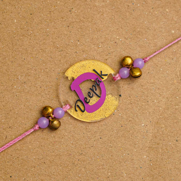 Personalized Handmade Alphabet Golden Acrylic Rakhi With Roli Chawal - Personalized Rakhi Close-up