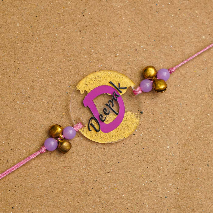 Personalized Handmade Alphabet Golden Acrylic Rakhi With Roli Chawal - Personalized Rakhi Close-up