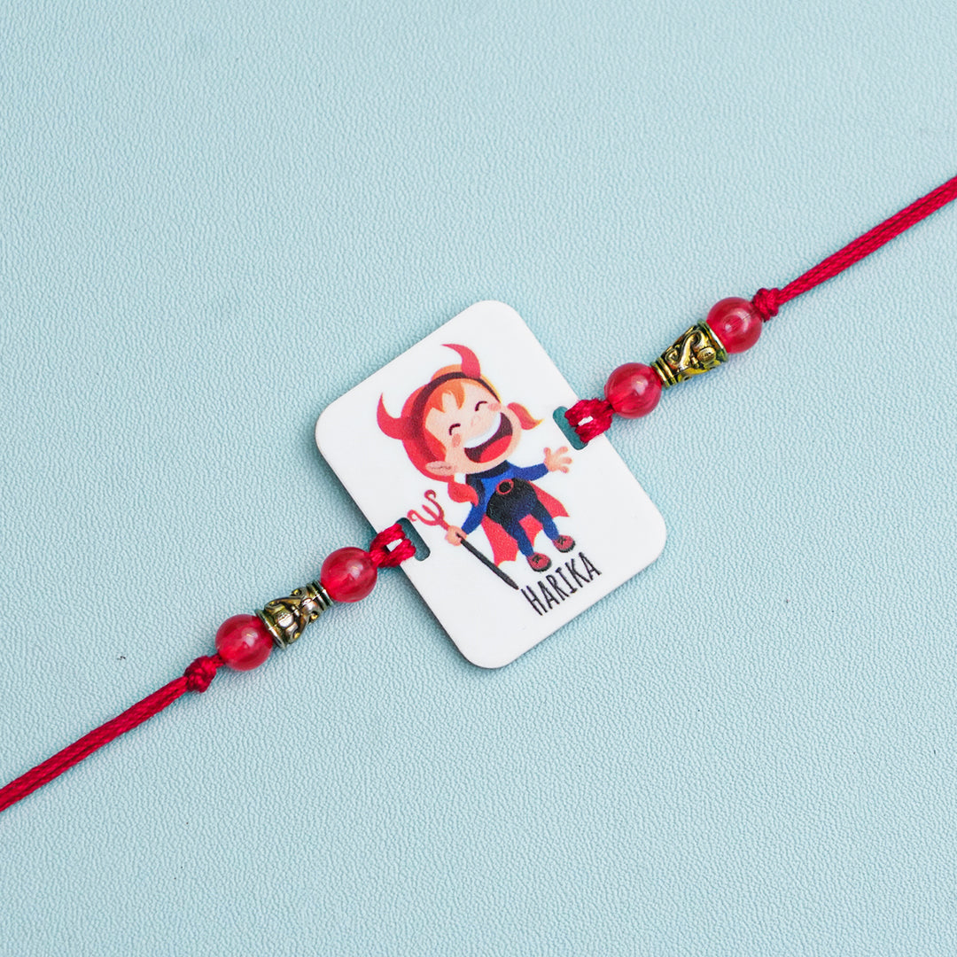 Personalized Handmade Devil Sister Acrylic Rakhi With Roli Chawal - Close-up of Single Rakhi Band