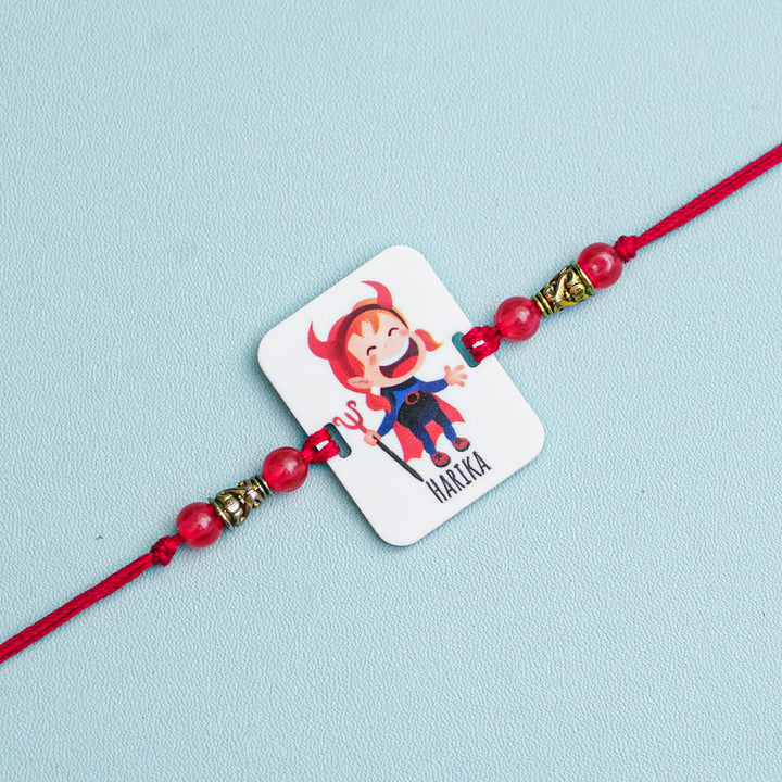 Personalized Handmade Devil Sister Acrylic Rakhi With Roli Chawal - Close-up of Single Rakhi Band