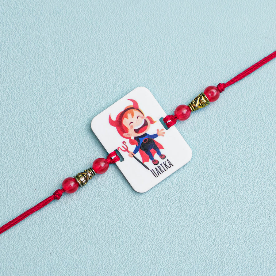 Personalized Handmade Devil Sister Acrylic Rakhi With Roli Chawal - Close-up of Single Rakhi Band
