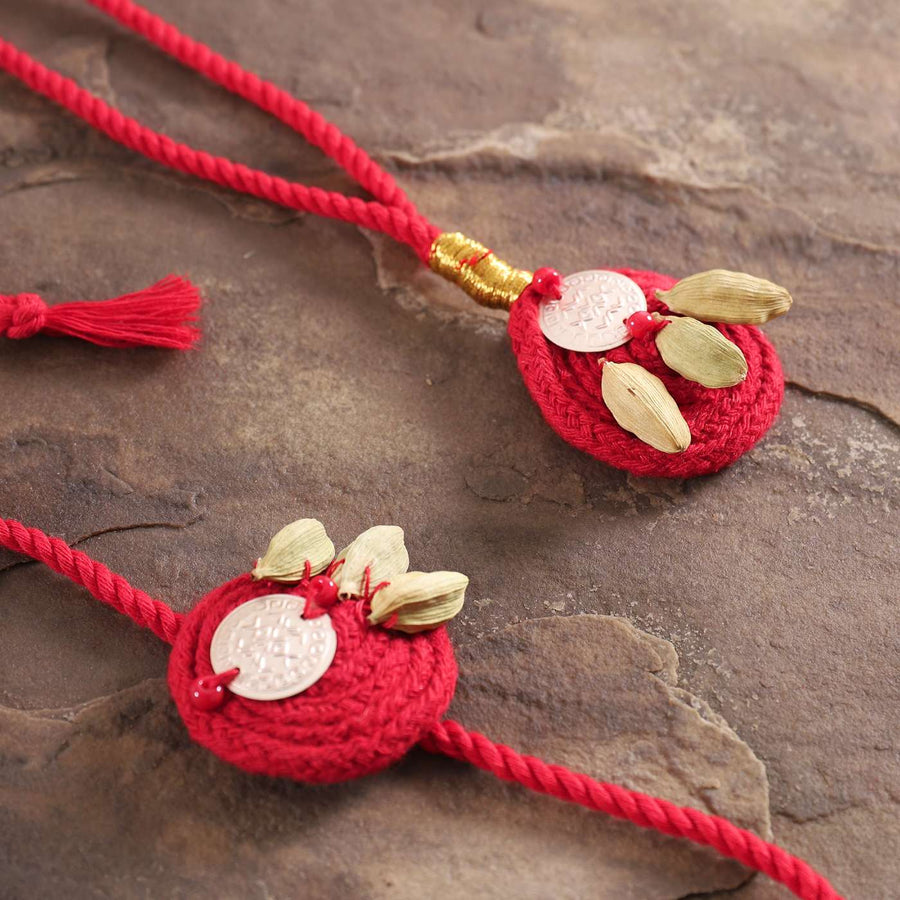 Handmade Elaichi Cotton Bhaiya Bhabhi Rakhi With Roli Chawal Set Of 2 - Close-up of Decorative Tassels