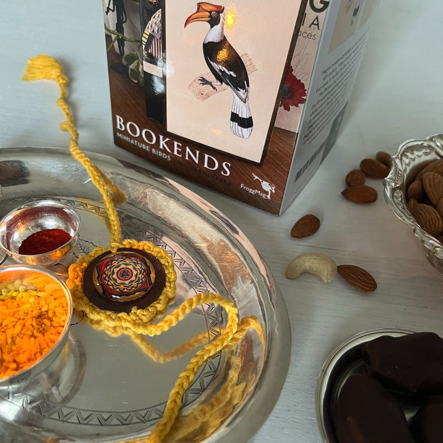 Handcrafted Crochet Folk Art Rakhi Hamper For Young Adults With Rice Roli Haldi 3 - Rakhi on silver plate