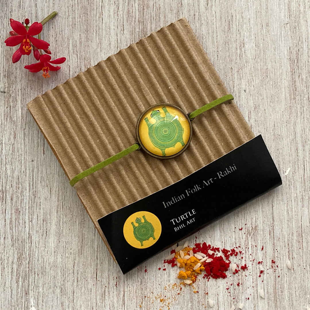 Handcrafted Folk Art Rakhi Hamper For Toddlers With Rice Roli Haldi 2 - Rakhi in packaging