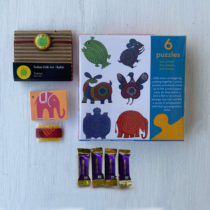 Handcrafted Folk Art Rakhi Hamper For Toddlers With Rice Roli Haldi 2 - Flat lay with all included items