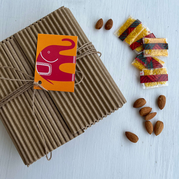 Handcrafted Folk Art Rakhi Hamper For Toddlers With Rice Roli Haldi 2 - Gift wrapping with tag and extras