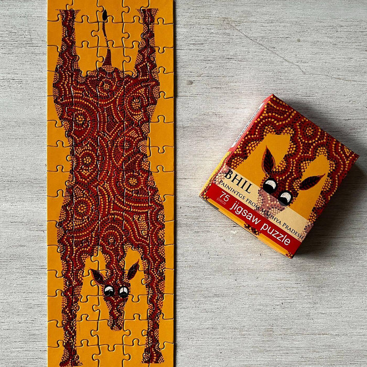 Handcrafted Folk Art Rakhi Hamper For Kids With Rice Roli Haldi 1 - Partially Completed Puzzle Next To Box
