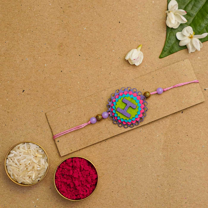 Personalized Handmade Felt Rakhi With Roli Chawal - Flat Lay with Accessories