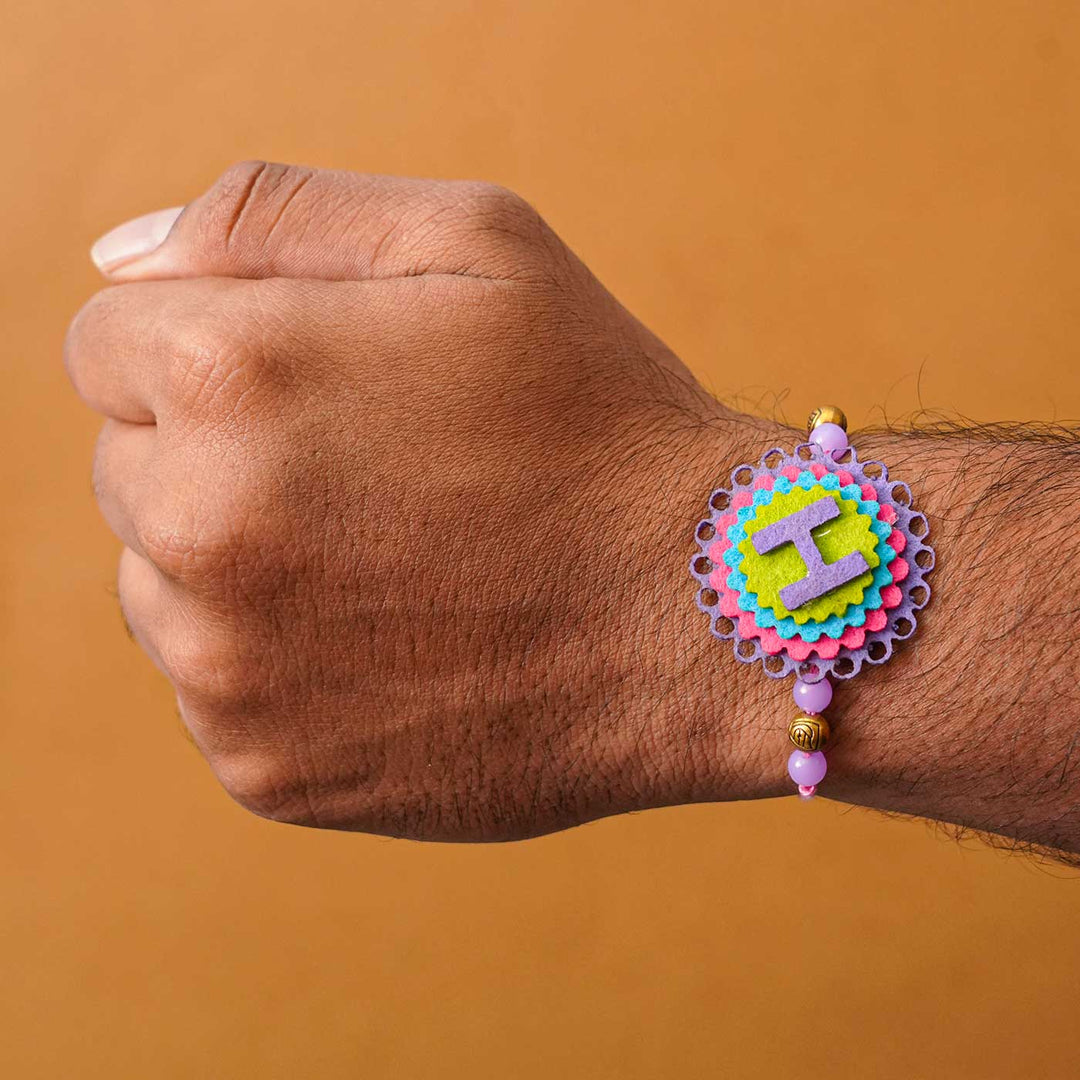 Personalized Handmade Felt Rakhi With Roli Chawal - On Wrist Front View