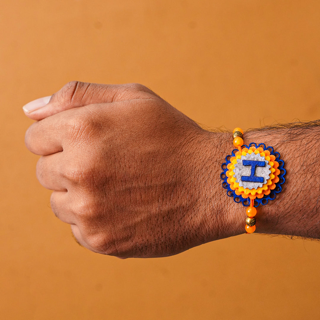 Personalized Handmade Felt Rakhi With Roli Chawal - On Wrist Front View (4)