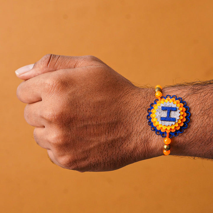 Personalized Handmade Felt Rakhi With Roli Chawal - On Wrist Front View (4)