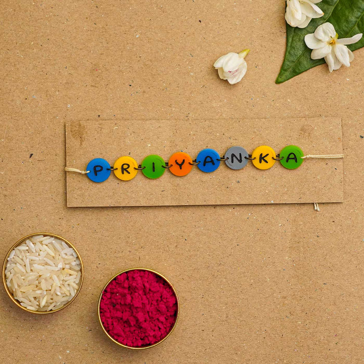 Personalized Handmade Gems Acrylic Rakhi With Roli Chawal - Name bead bracelet with rice and flowers