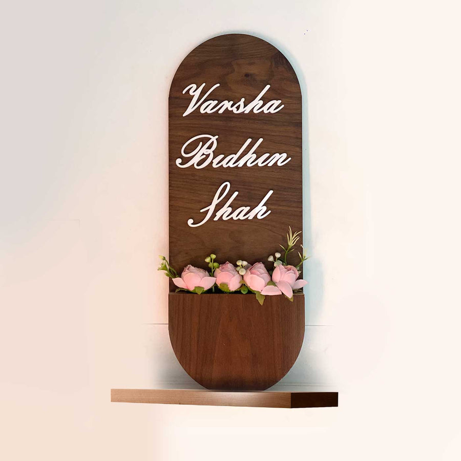 Tall Arched Wooden Name Plate With Floral Basket 3D Letters - Front View with Floral Decoration