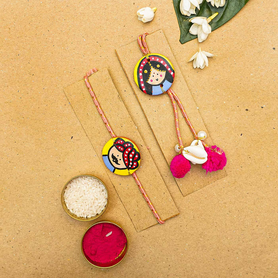 Handcrafted Raja Rani Terracotta Rakhi With Roli Chawal - Bracelets on display cards with accessories