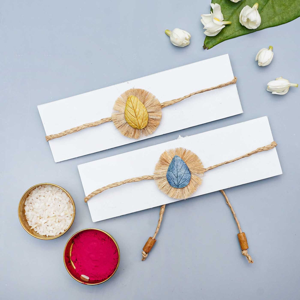 Handmade Papier Mache Yellow And Blue Leaf Rakhi With Roli Chawal Set Of 2 - Bracelets on Display Cards