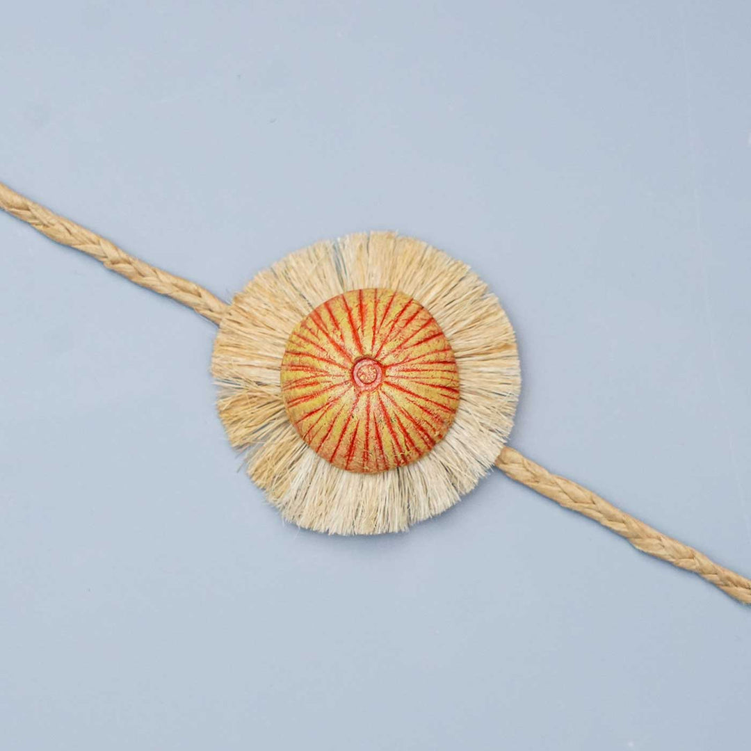 Handmade Papier Mache Rustic Floral Rakhi With Roli Chawal - Close-up of Rakhi design
