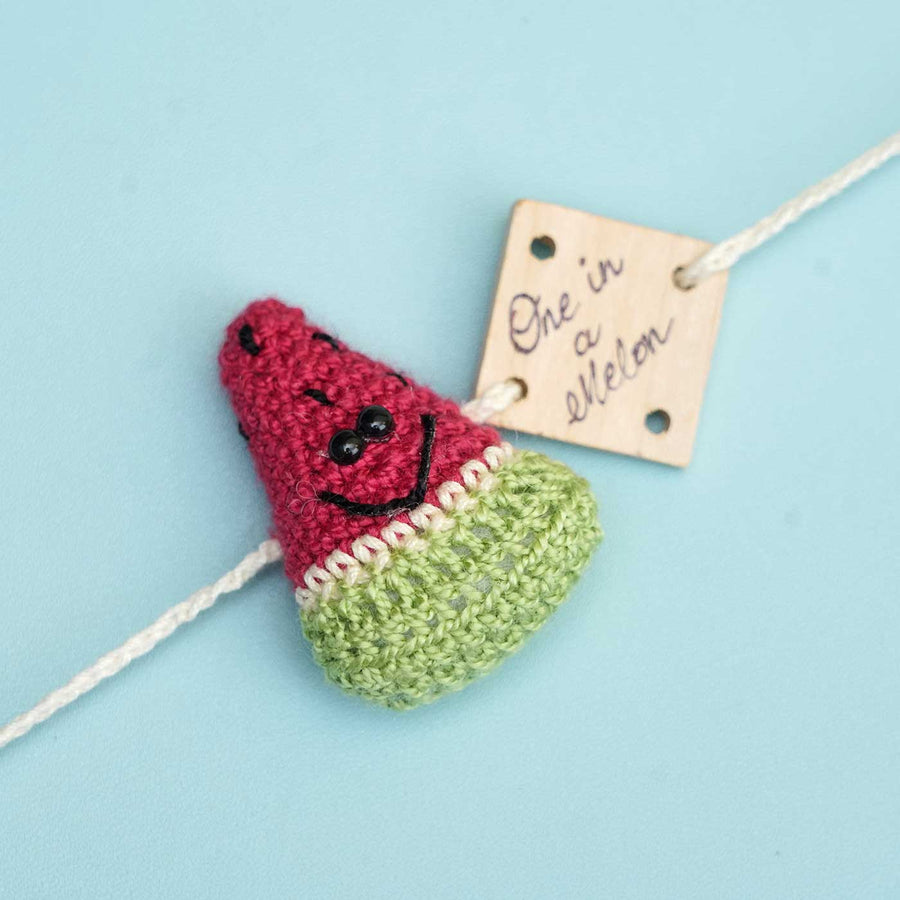 Handmade Crochet One In A Melon Kids Rakhi With Roli Chawal - Close-up Front View