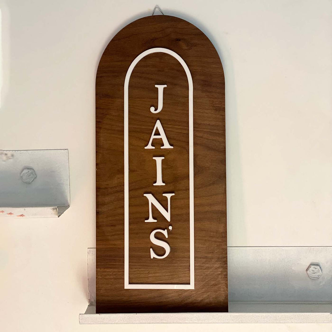 Vertical Arched Wooden Name Plate With 3D Acrylic Letters - Front View Hanging on Wall
