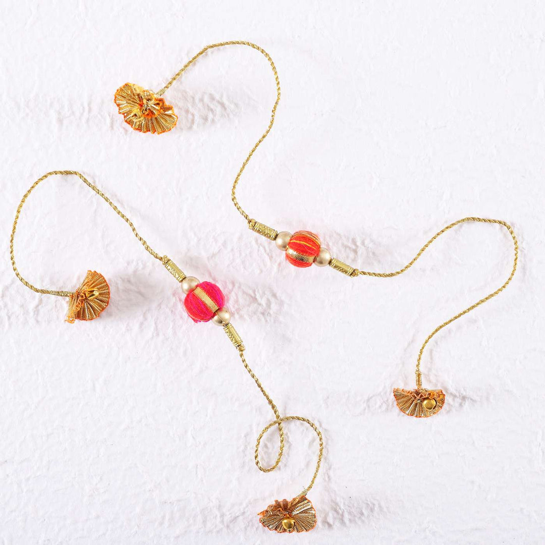 Handmade Beaded Jhilmil Gota Rakhi With Roli Chawal Set Of 2 - Flat Lay on White Surface
