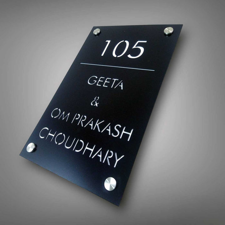 Personalized Sleek Black Acrylic Vertical Name Plate - Angled Front View Mounted on Wall