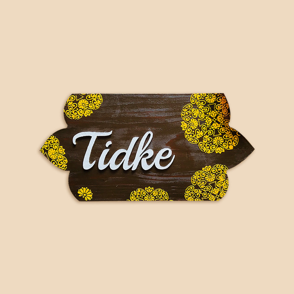 Handcrafted Personalized Curvy Pinewood Textured Name Plate - Top-down Front View on Flat Surface