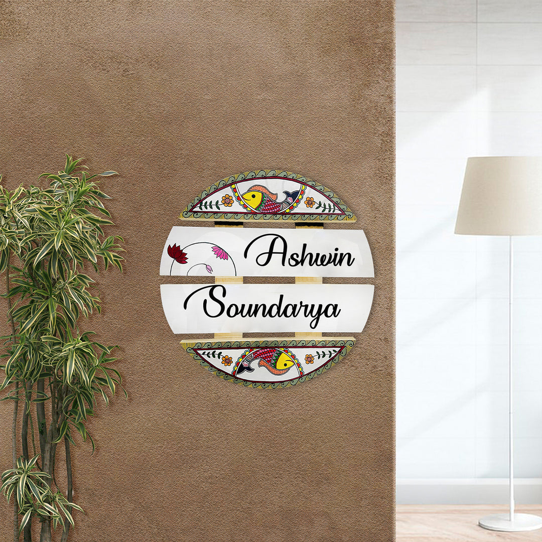 Handcrafted Personalized Madhubani Art Round Pinewood Name Plate 1 - Mounted on Entryway Wall with Plant