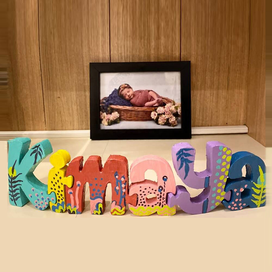 Hand Painted Wooden Jigsaw Name Blocks For Christening Ceremony - Front View on Flat Surface