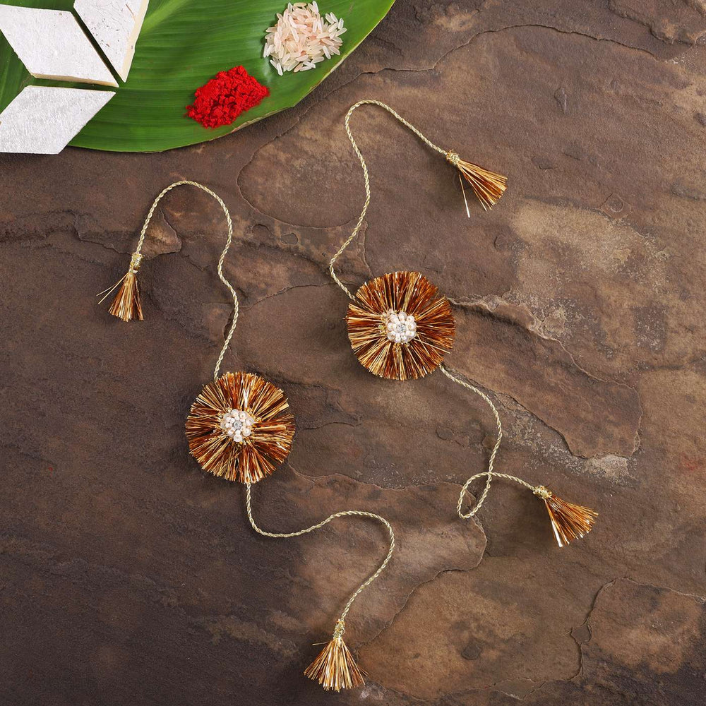 Handmade Beaded Kiran Zari Rakhi With Roli Chawal Set Of 2 - Flat Lay with Decorative Elements