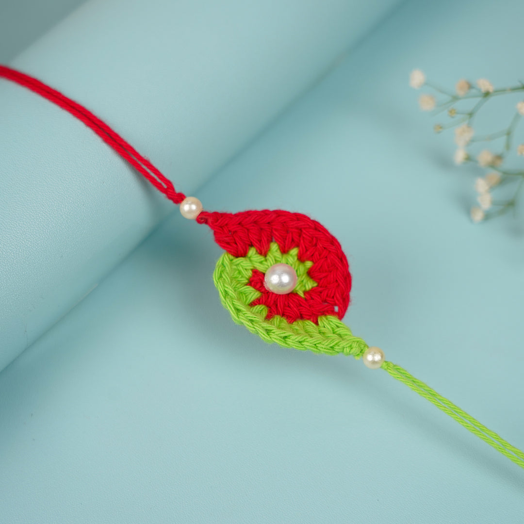 Customized Handmade Crochet Spiral Rakhi With Roli Chawal For Brother - Side View on Cylindrical Surface (8)