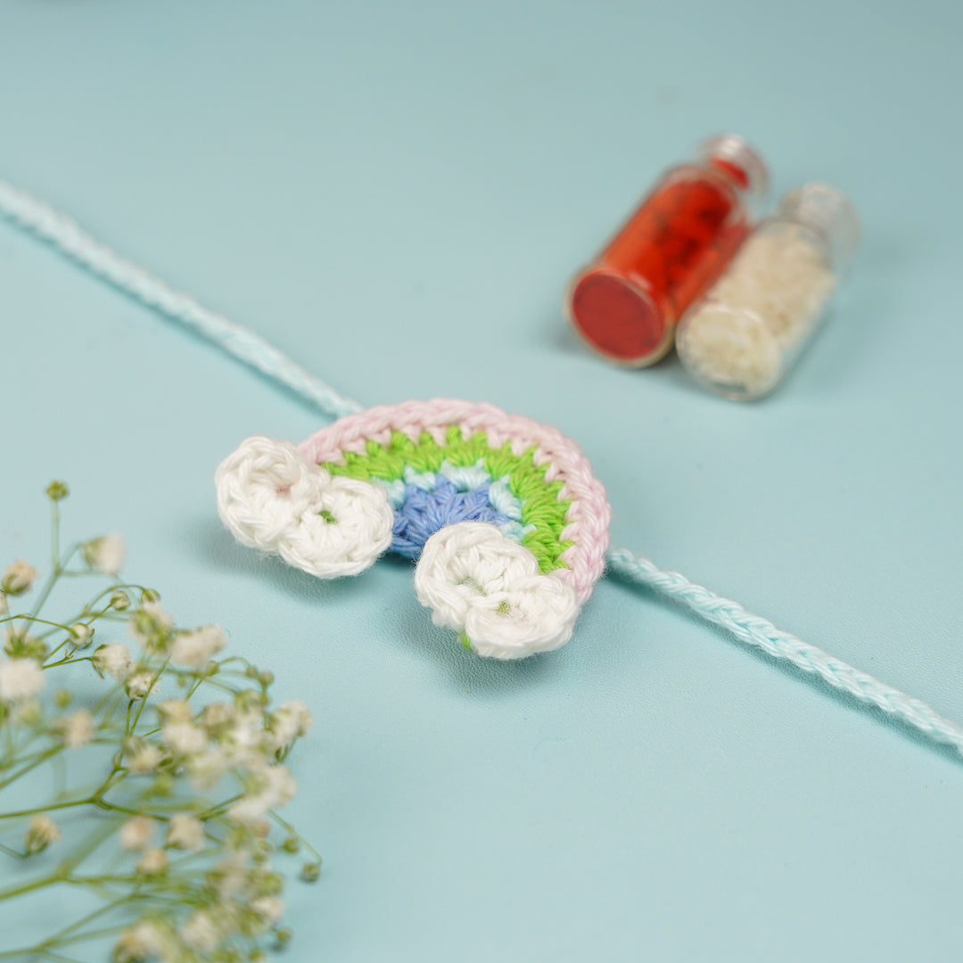 Handmade Crochet Rainbow Rakhi With Roli Chawal 1 - Angled Side View