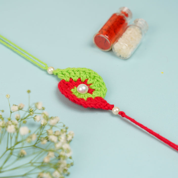 Customized Handmade Crochet Spiral Rakhi With Roli Chawal For Brother - Close-up Front View with Roli Chawal
