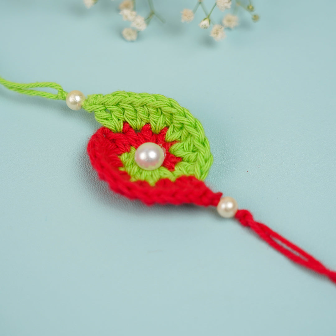 Customized Handmade Crochet Spiral Rakhi With Roli Chawal For Brother - Close-up Front View