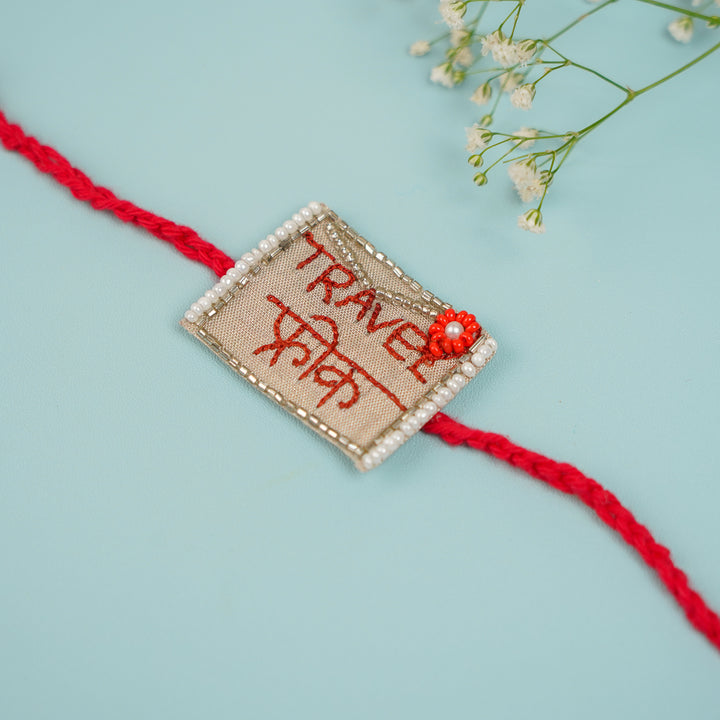 Handmade Beaded Travel Freak Rakhi With Roli Chawal For Brother - Close-up of Rakhi thread detail