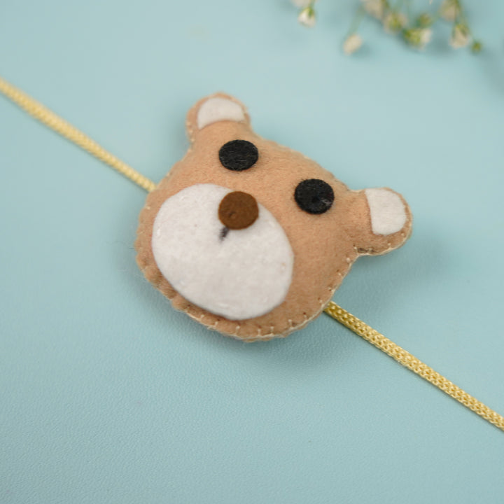 Handmade Teddy Theme Felt Rakhi With Roli Chawal - Close-up on Bear Face Rakhi