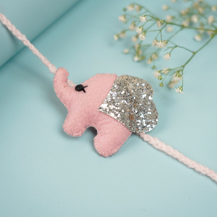 Handmade Glitter Elephant Felt Rakhi With Roli Chawal - Pink Elephant Rakhi Angle View