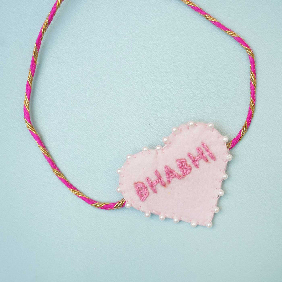 Handmade Pink Heart Felt Rakhi With Roli Chawal For Bhabhi - Close-up of Heart Pendant