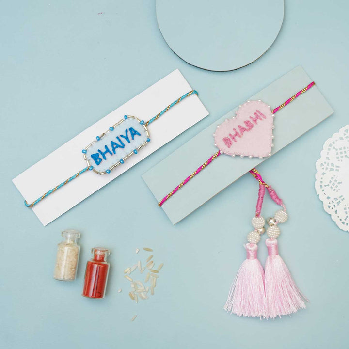 Handmade Felt Bhaiya Bhabhi Rakhi With Roli Chawal Set Of 2 - Rakhis with Rice and Color Powders