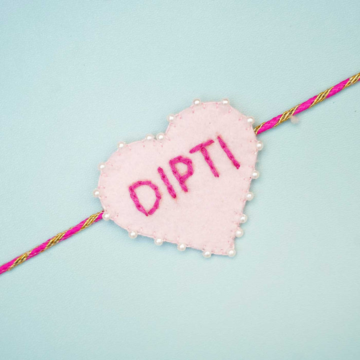 Personalized Handmade Pink Heart Felt Rakhi With Roli Chawal - Close-up of single rakhi