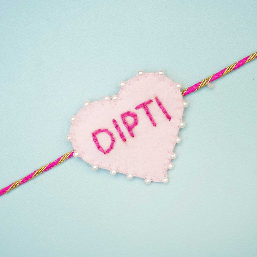 Personalized Handmade Pink Heart Felt Rakhi With Roli Chawal - Close-up of single rakhi