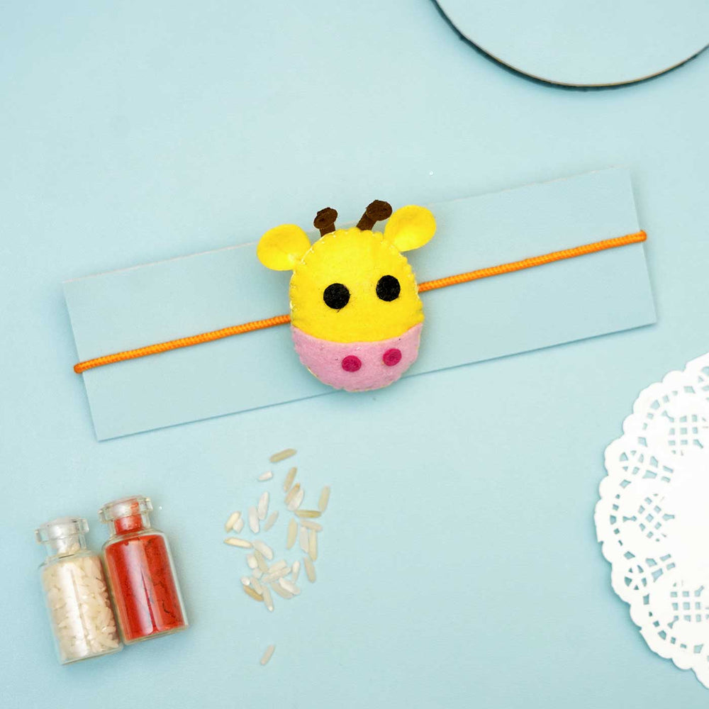 Handmade Giraffe Felt Rakhi With Roli Chawal - Yellow Giraffe Rakhi on Card Display