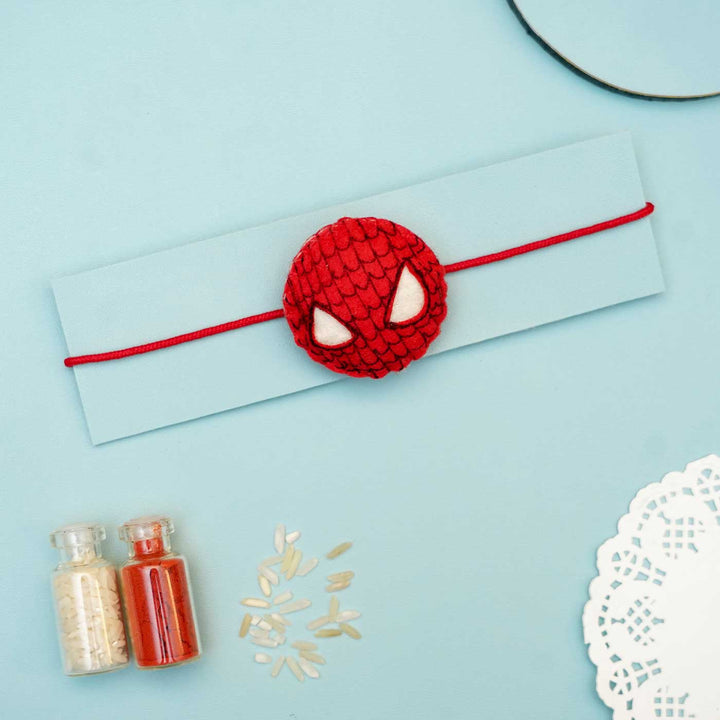 Handmade Spider Man Felt Rakhi With Roli Chawal - Flat Lay on Display Card